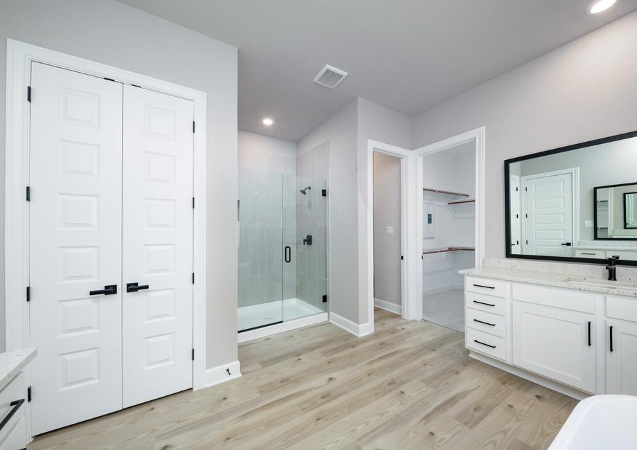 In the master bath you will find a walk-in shower and standalone tub.