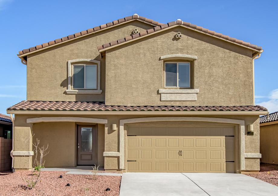 The Stafford by LGI Homes has a stucco exterior and a two-car garage.