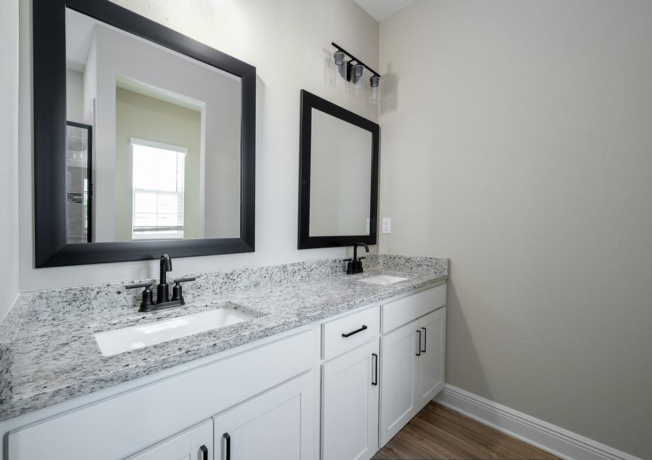 There are two sinks in the master bedroom perfect for getting ready in the morning.