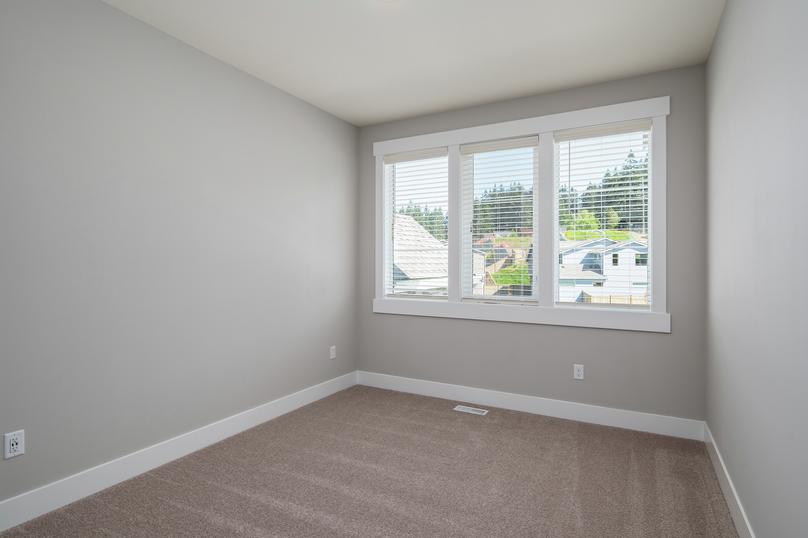 All of the secondary bedrooms are spacious and feature beautiful windows.