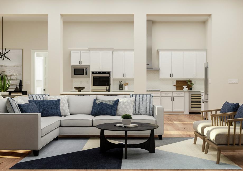 Rendering of the open floor plan living
  room featuring a sectional couch, coffee table and two armchairs. The kitchen
  and dining room are visible in the background.