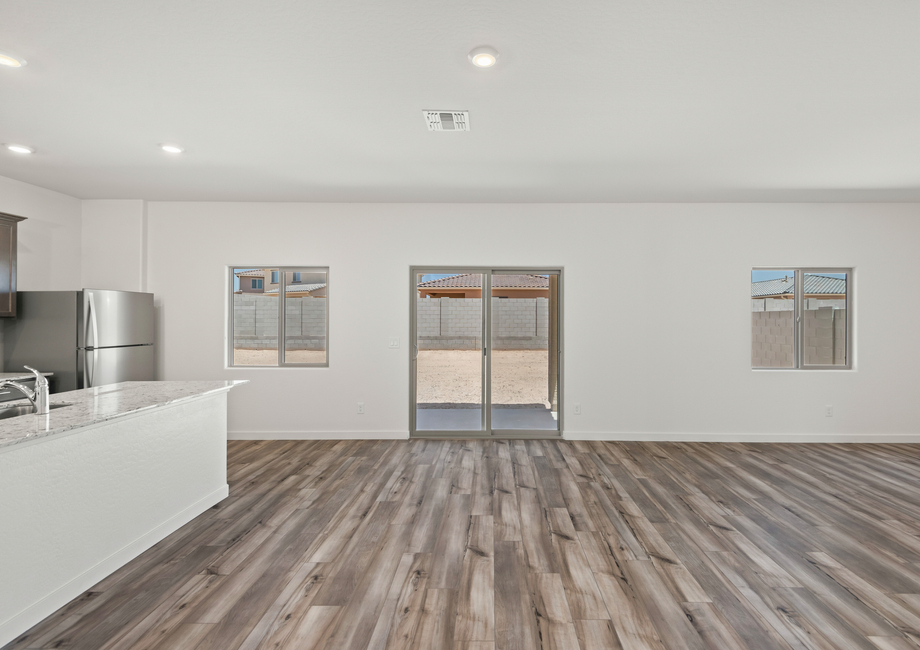 Sliding glass doors welcome you to your backyard oasis.