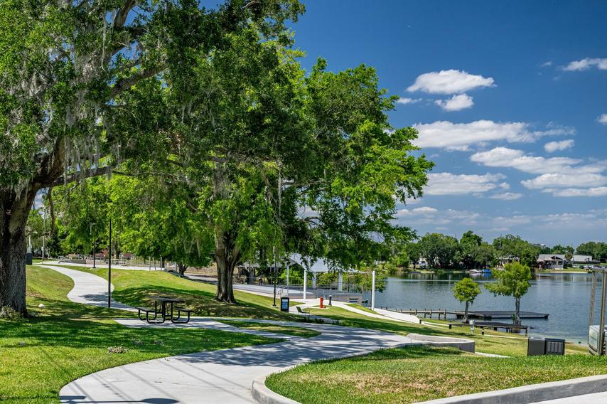 Bench overlooking walking trail in a park in Winter Haven, Florida