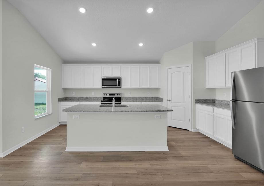 The kitchen comes with a full suite of energy-efficient appliances!