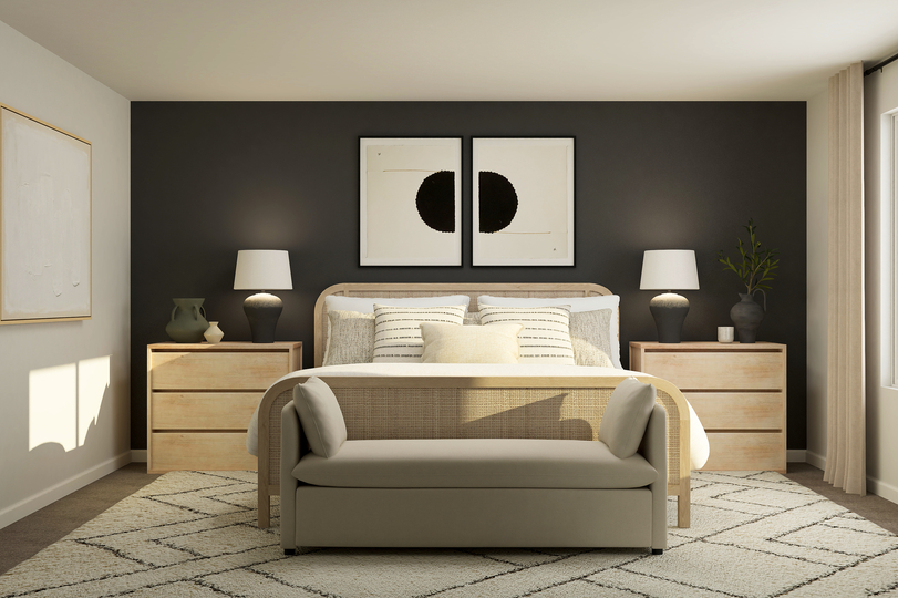 Rendering of a
  bedroom furnished with a white couch and two side tables. There is also a
  bench at the end of the table.