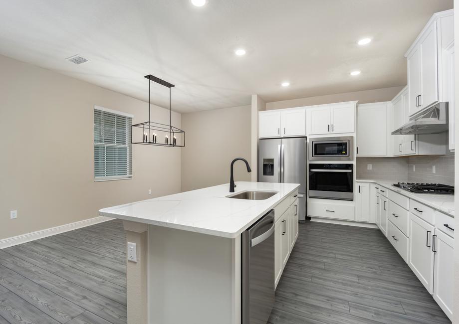The kitchen comes with a full suite of energy-efficient appliances!