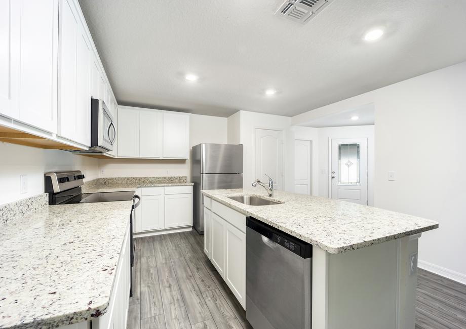 The front foyer leads to the chef-ready kitchen