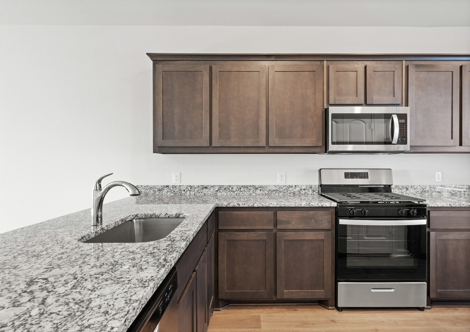 The kitchen has upgraded fixtures and features.