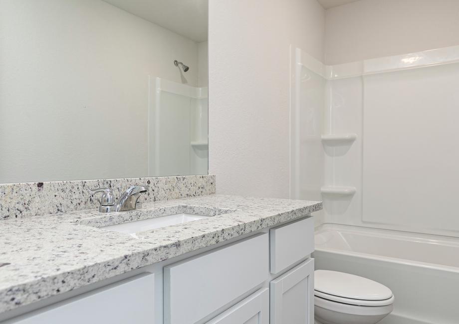 The second bathroom offers plenty of space for your guests to get ready