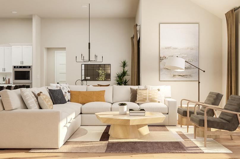 Rendering of the living area showing a
  large white sectional, coffee table, matching accent chairs, a view of the
  dining area and kitchen in the background, and light wood flooring
  throughout.