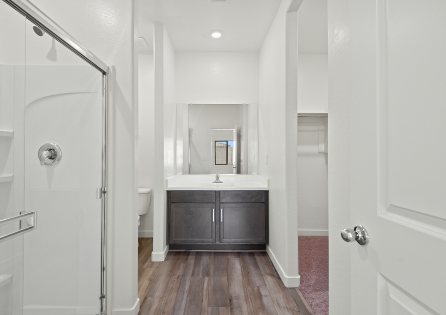 This bathroom features a glass-enclosed shower.