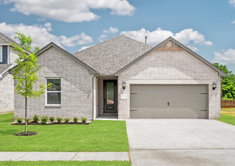 Beautiful exterior of a brick home with a wood accent.