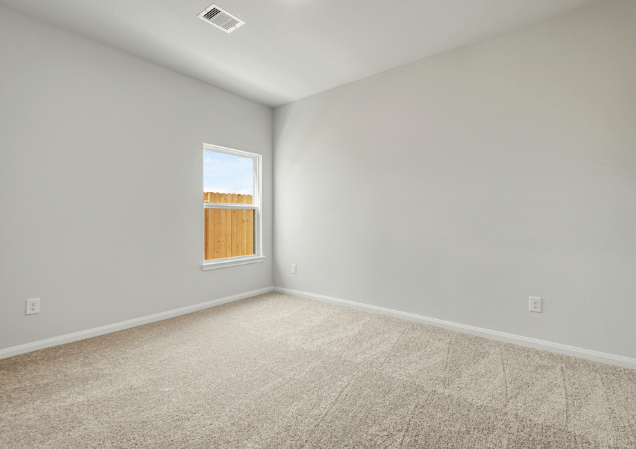 Spacious bedroom with carpet flooring