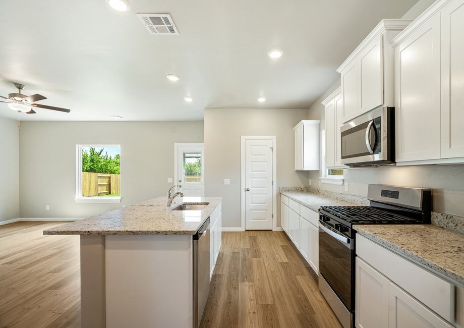 The kitchen overlooks the dining and living area.
