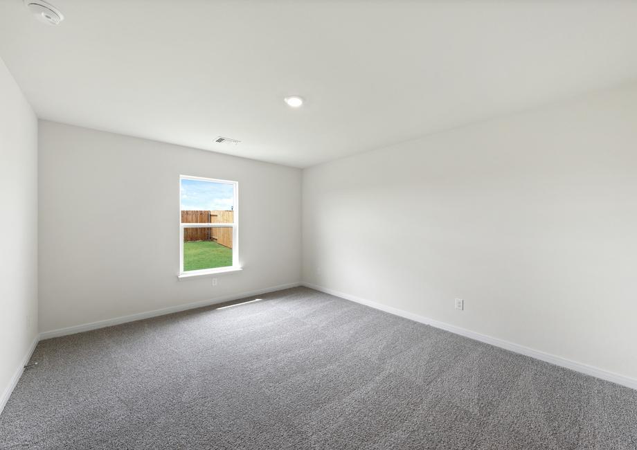 The master bedroom has a large window with great natural light and backyard views.