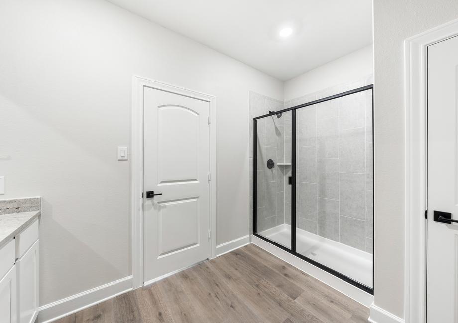 The master bathroom of the Blanco has a glass, walk-in shower.