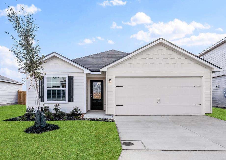 The exterior of the Frio with black shutters and front yard landscaping.