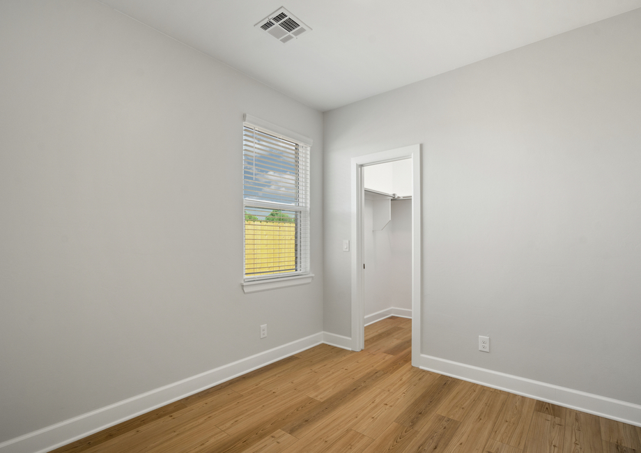 The master bedroom has a window that lets in great, natural light.