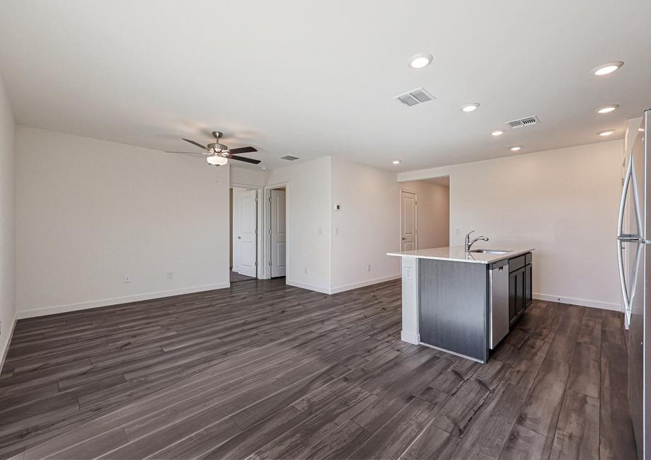 The kitchen overlooks the spacious living area.