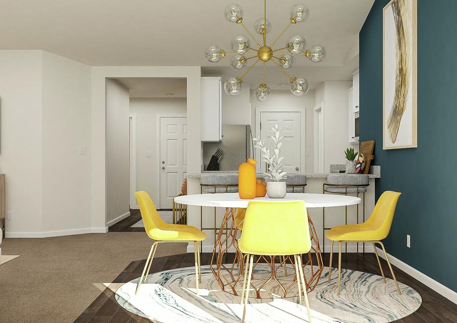 Rendering of the open floor plan in the
  Alamance, showing the dining area in front of the kitchen.