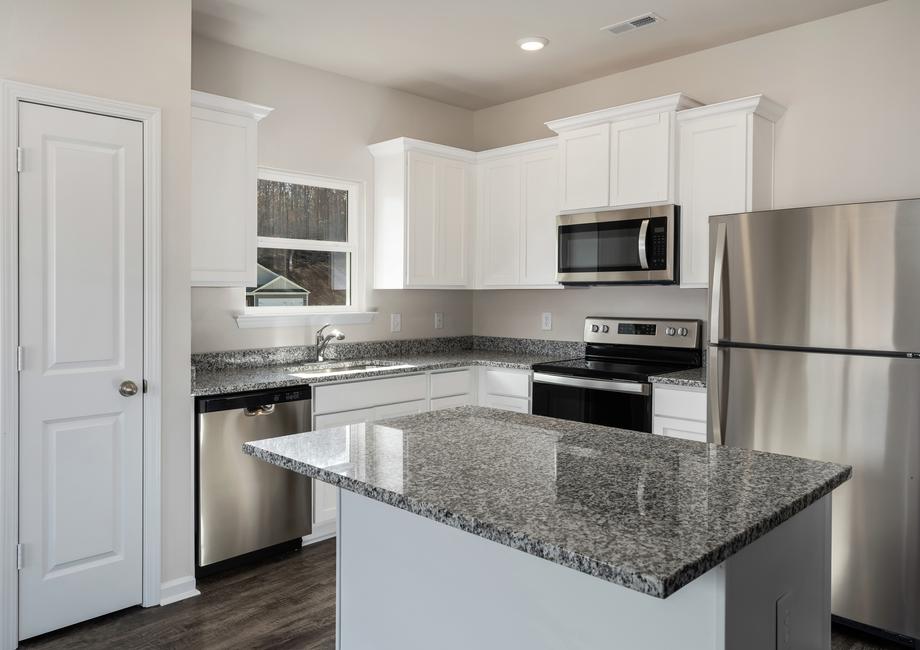 Gorgeous, upgraded kitchen with an island and stainless steel appliances