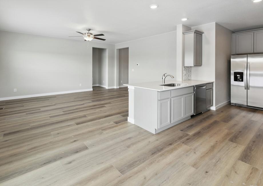 The open-concept floor plan of the Chatfield  gives way for easy access between the kitchen and family room.