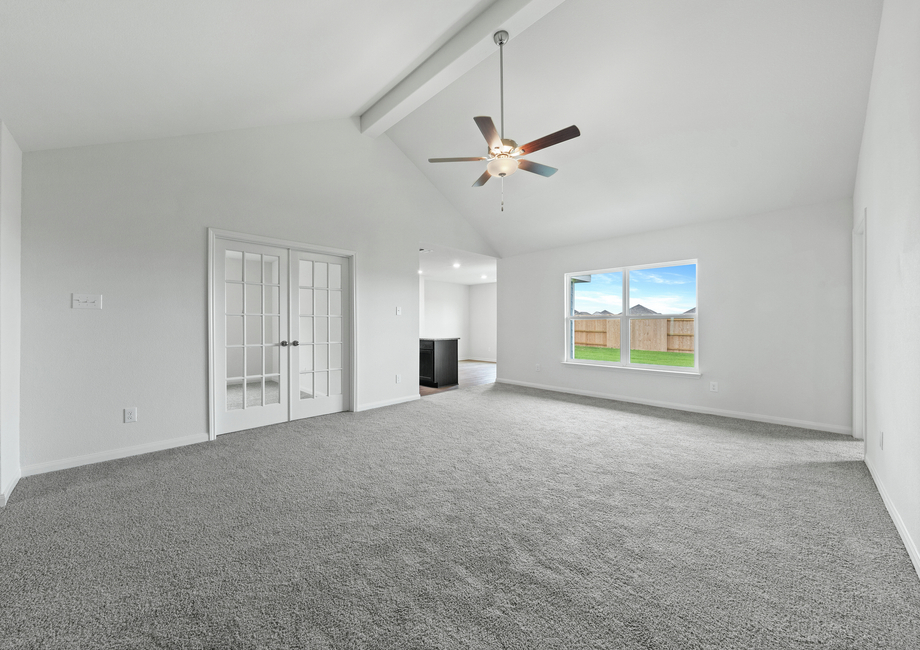 The family room of the Sabine has a large window with great natural light and back yard views.