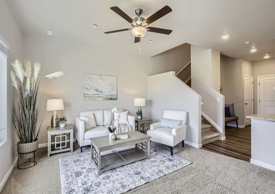 The family room is spacious with a ceiling fan.