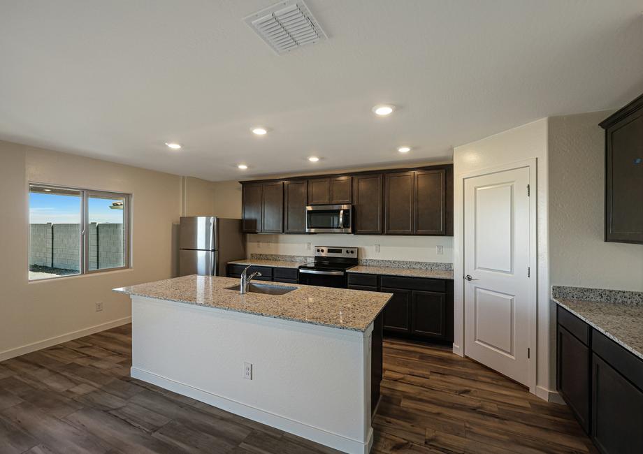 The kitchen comes with a full suite of stainless steel appliances!