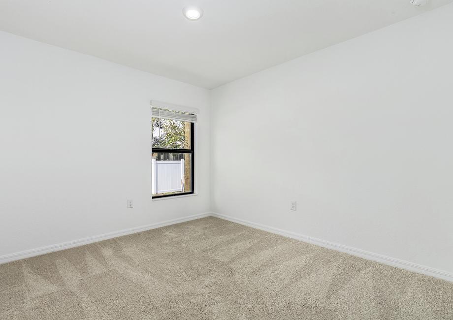 The other bedrooms in the Estero come with tan carpets, closets and windows