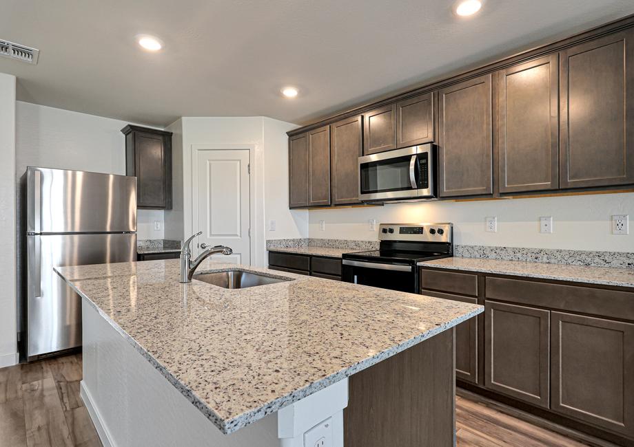 The spacious kitchen is perfect for preparing your family's favorite meals and treats.