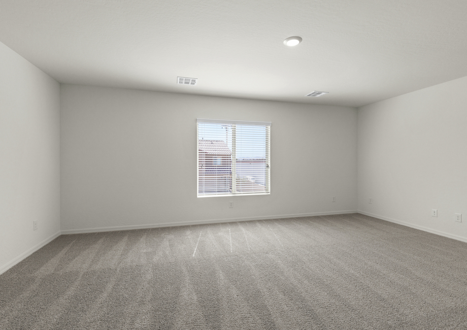 The master bedroom of the Cypress plan is spacious with lots of natural light.