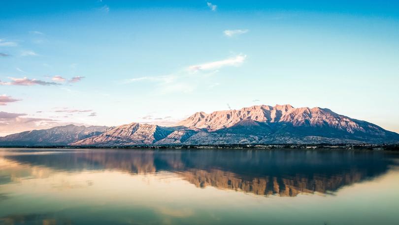 Mountains surrounded by a lake.