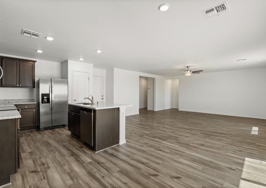 The kitchen overlooks the living room.