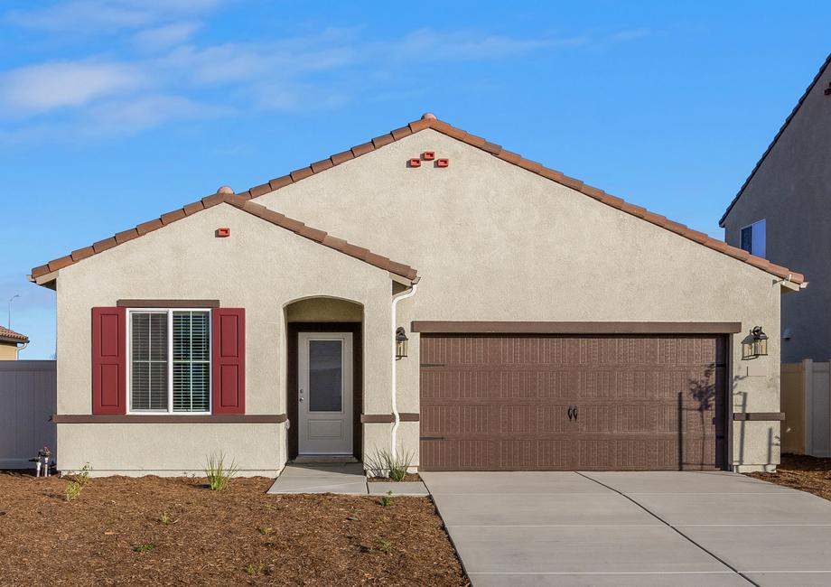 This home features a beautiful stucco exterior with vibrant red shutters.