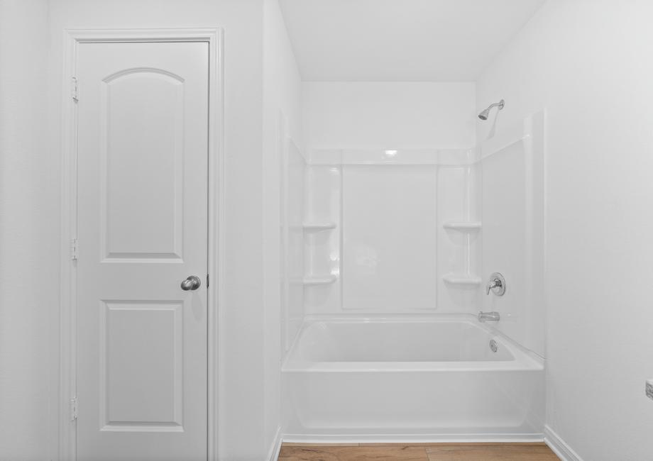 The master bathroom comes with a tub/shower combination.