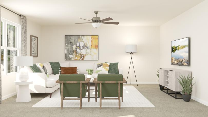 Rendering of the spacious living room in
  the Pennington furnished with a white sectional, white side table, two green
  accent chairs, a floor lamp and a gray media console table.