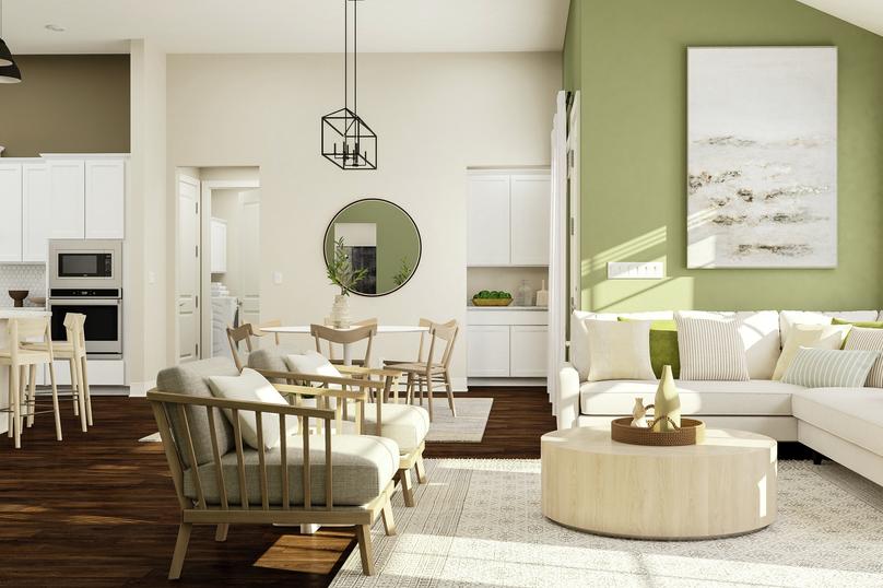 Rendering of living room area showing a
  white sectional couch along a green accent wall and large windows, a coffee
  table, accent chairs, and a view of the kitchen and dining space in the
  background with dark wood look flooring throughout.