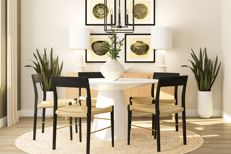 Rendering of the dining room with a
  round, five-person table and decorative cabinet. The space has wood-look
  vinyl plank flooring, a large window and is located off the kitchen.