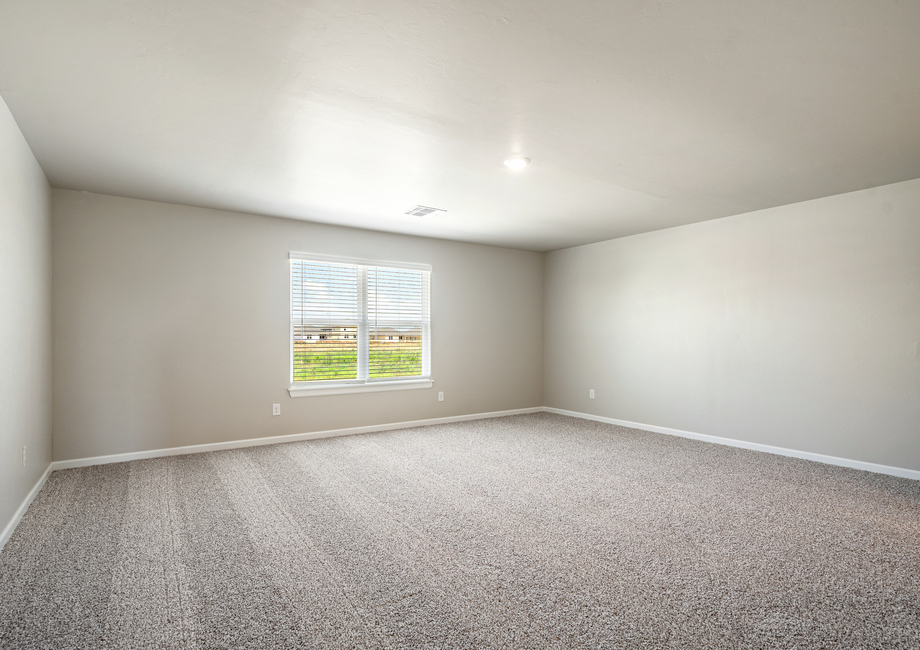 A spacious game room upstairs is the perfect place to entertain family and guests.