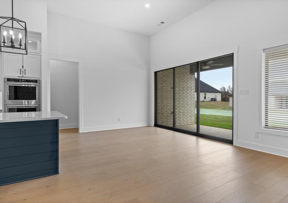 The open breakfast area has plenty of natural light from the sliding back doors.