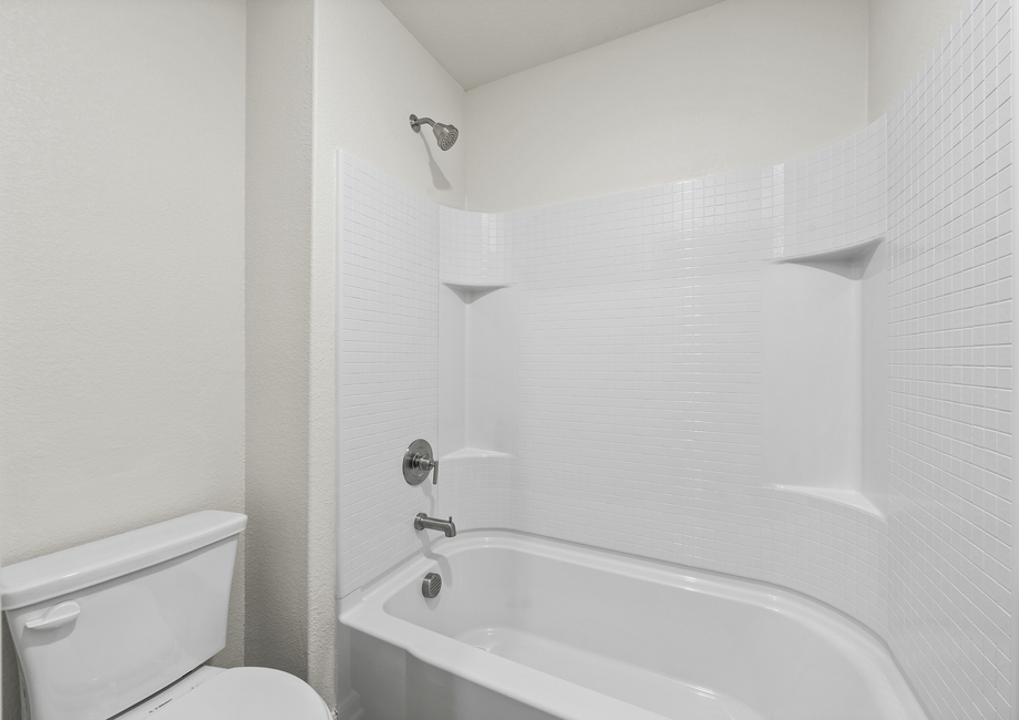 The secondary bathroom has a shower-tub combo.