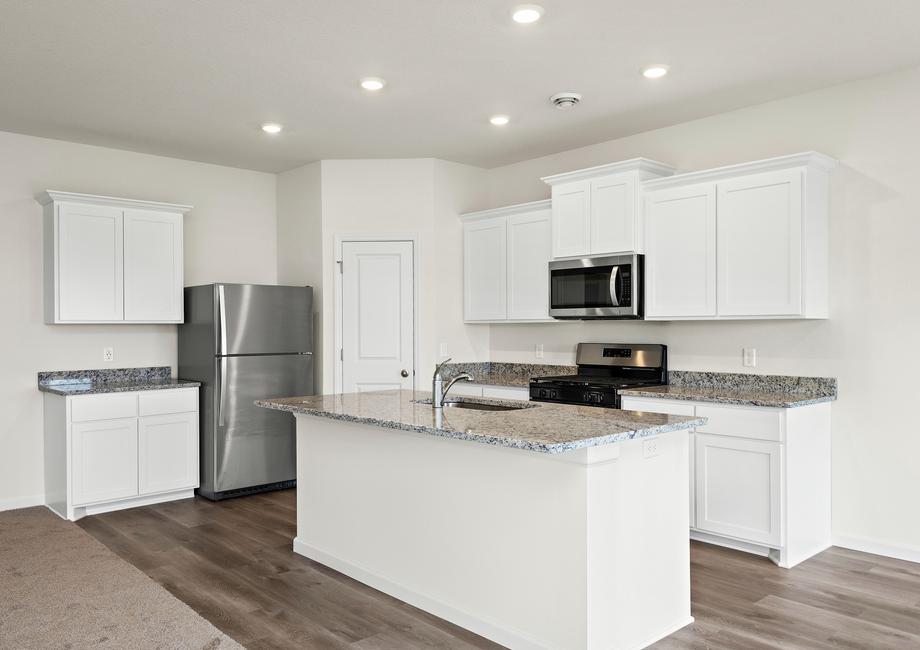 The kitchen has stainless steel appliances.