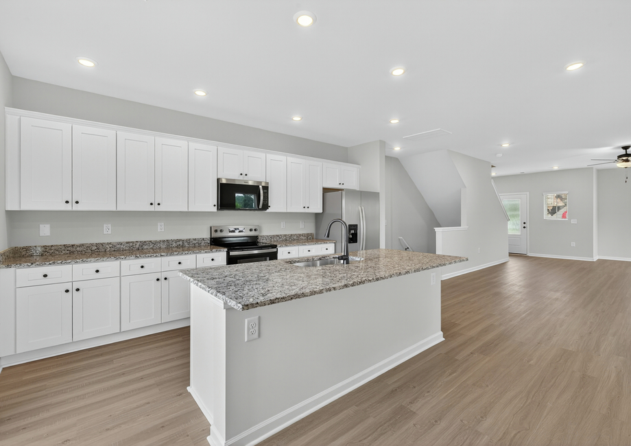 Designer white cabinets in the kitchen.