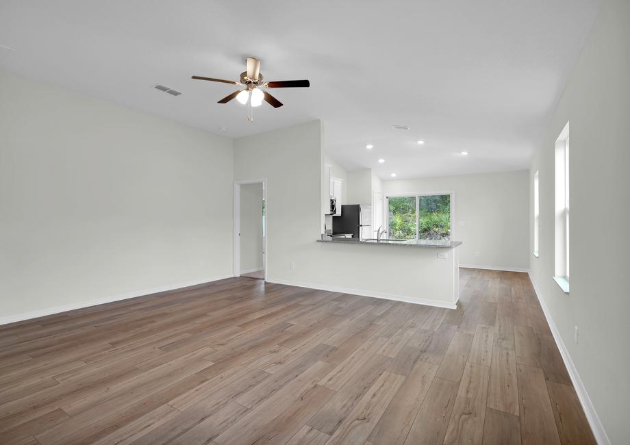 Move easily between the family room and the kitchen in this open entertainment area