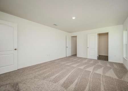 The master bedroom is spacious and has access to its own bathroom