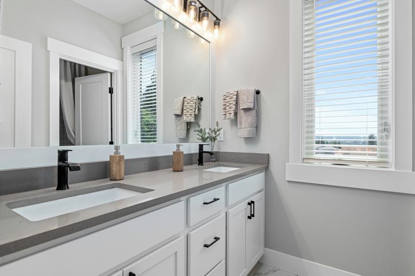 This secondary bathroom has a spacious dual-sink vanity.