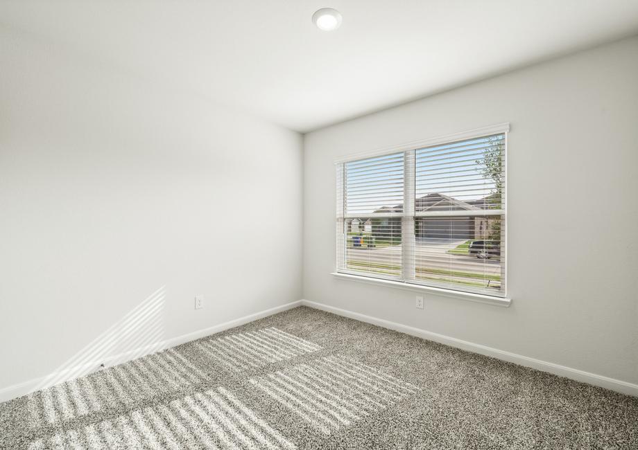 The secondary bedroom is a great space as a child's bedroom.