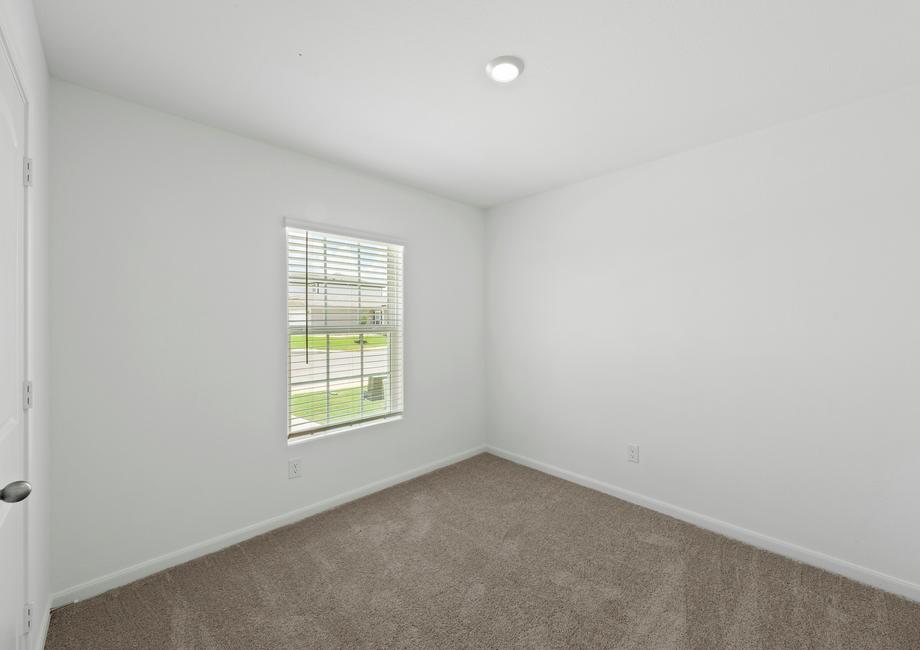 A secondary bedroom with its own closet