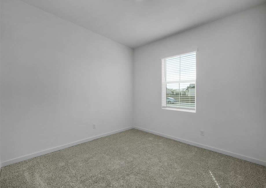 The secondary bedroom has carpet.